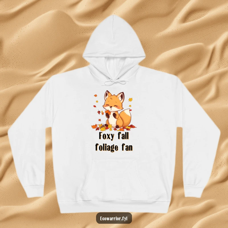 Funny Hoodie depicting a content fox gathering a bounty of colorful autumn leaves, radiating warmth.