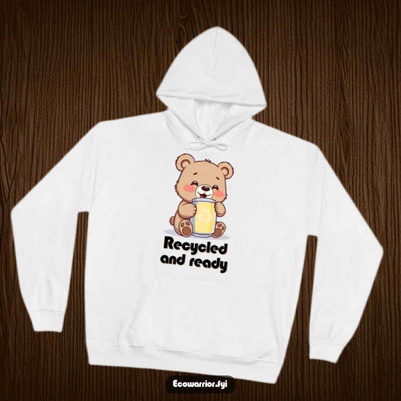 Funny bear cub hoodie, showing a jubilant cub gleefully polishing a metallic recycled can, radiating positivity and eco-consciousness.