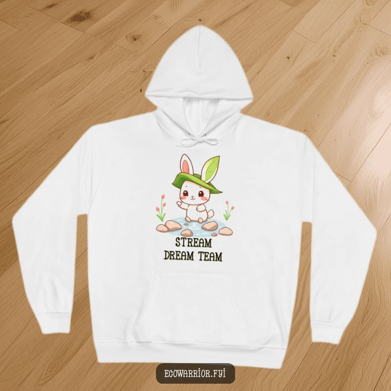 Funny rabbit character wearing a leaf hat, pointing at a clean stream, featured on a warm hoodie for cozy outdoor exploration.